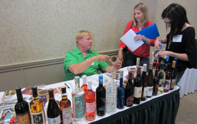 lictostealtable Otto Knop, sales rep for Innovative Labeling Solutions, a conference exhibitor.