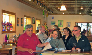 David Danzinger discussing wine with customers at his winery in Alma,  Wisconsin.