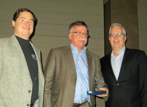Steve Zeller presents the award for "Best Cold Climate White Wine" to Paul Quast and Peter Hemstad of St. Croix Winery 