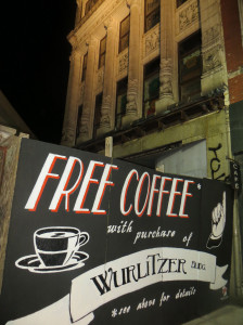 The sign above reads, "Free Coffee with Purchase of Wurlitzer Building."