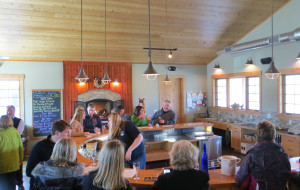 Boathouse Vineyards in Lake Leelanau, Michigan designed a circular tasing room bar with extra space for employees to service multiple customers.