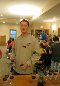 Colin  of Wollerhsheim Winery.  Each guest at the wine cave ribbon cutting received a free taste of estate grown Domaine Du Sac with which to make a toast. 
