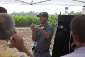 A Dow representative demonstrates herbicide spray nozzles in Tennessee