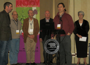2013 Michigan Competition Gold Medal winners: John Kroupa, Peninsula Cellars; Dave Miller, White Pine Winery, Dan Matthies, Chateau Fontaine; Joe Herman, Karma Vista; Lee Lutes, Black Star Farms.  (Not pictured, Coenraad Stassen, Brys Estate.) Linda Jones of the Michigan Grape and WIne Industry Council, far right. 