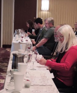 Members of the Iowa wine industry at the annual Iowa Wine Growers Association meeting in March 2013 participate in a tasting and evaluation of Marquette wines treated with enological tannins.