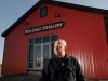 Gene Sigel stands in front of his Red Eagle Distillery, his latest business venture that was based upon a hunch on how the industry is evolving.