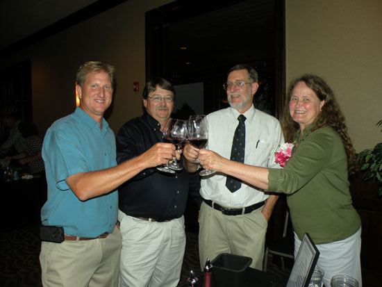Indiana Uplands Wine Trail winemakers and owners—(L to R) Ted Huber of Huber Winery; John Doty of French Lick Winery; and Jim and Susie Butler of Butler Winery—share a relaxed moment as the festivities wound down.